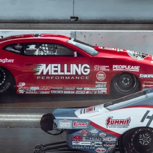 The Lodges of Huntersville Two cars race on a track, featuring the phrase "melting performance" prominently on the side of one vehicle.