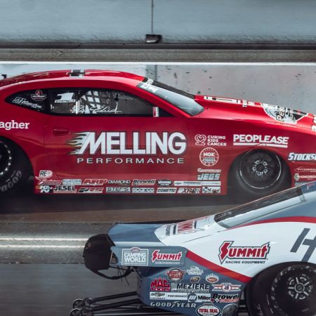 The Lodges of Huntersville Two cars race on a track, featuring the phrase "melting performance" prominently on the side of one vehicle.