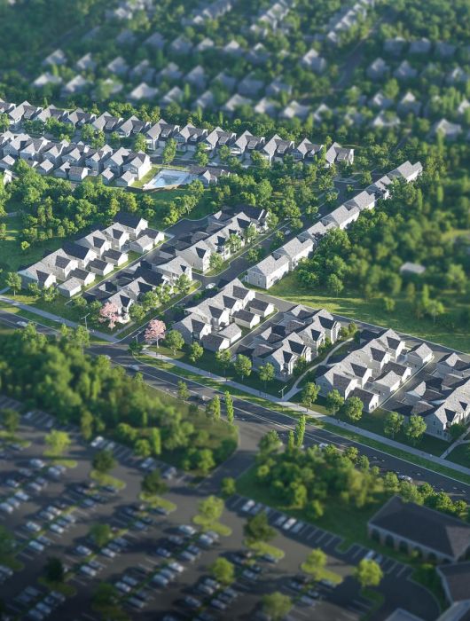 The Lodges of Huntersville Aerial view of a sprawling cityscape bordered by lush green trees, showcasing urban and natural elements in harmony.